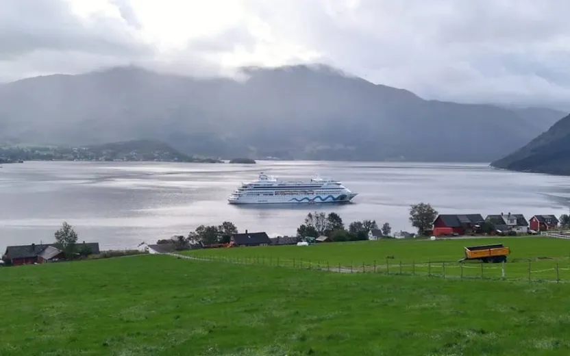 Cruise ship docked at the port of Rosendal, Norway