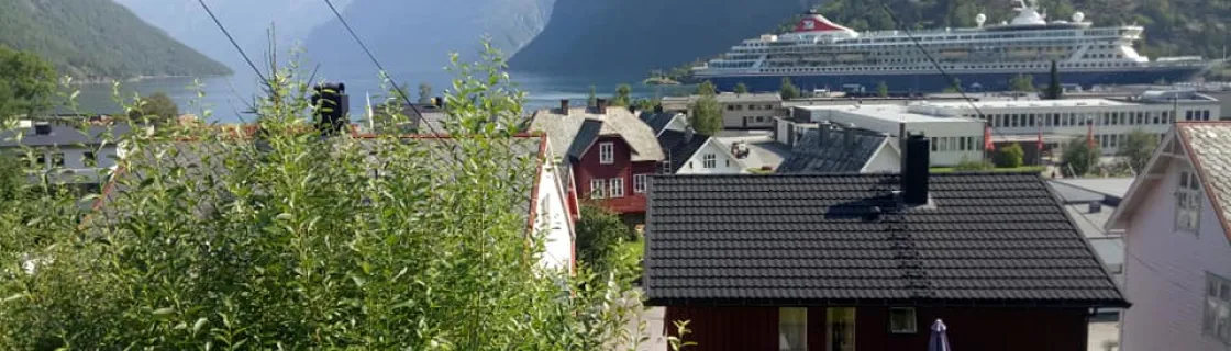 Cruise ship docked at the port of Hellesylt, Norway