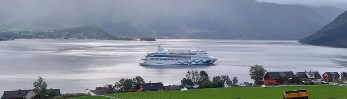 Cruise ship docked at the port of Rosendal, Norway